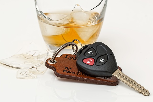 car keys next to glass of liquor